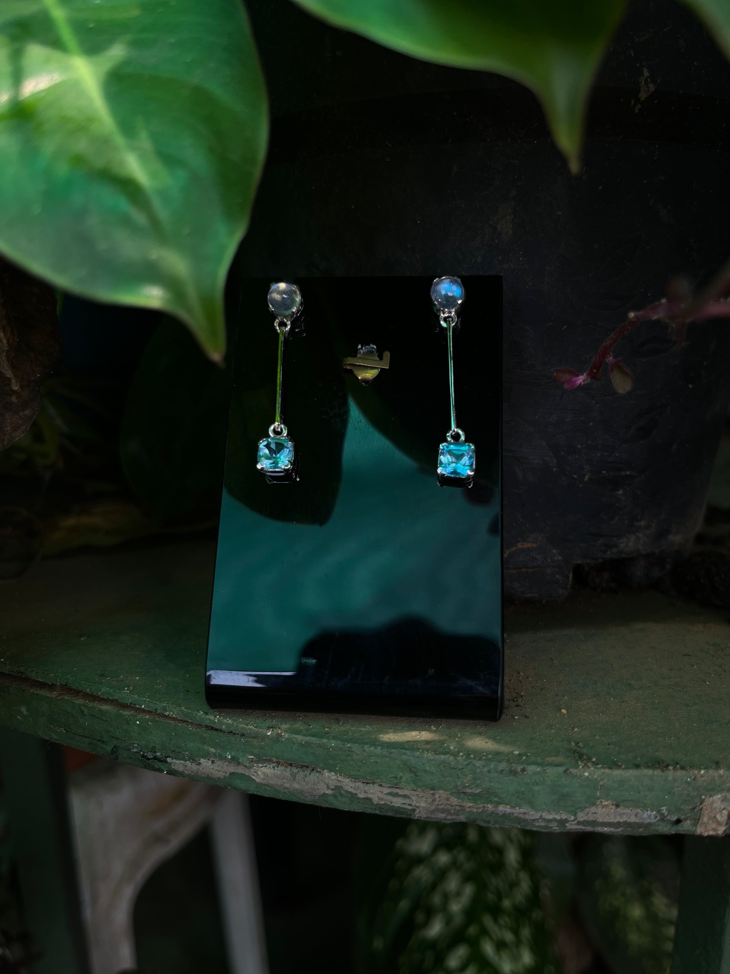 Elegant Blue Topaz and Moonstone Dangling Earrings in 92.5 Silver